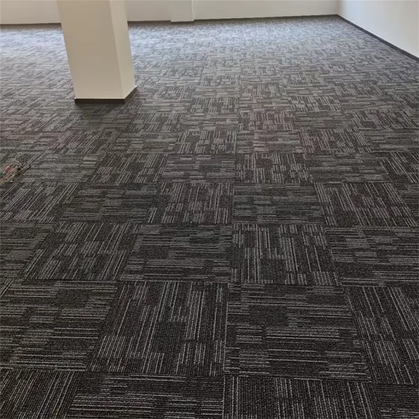 Grey linear loop pile carpet tiles in an office setting.