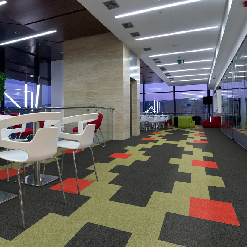 Modern geometric carpet tiles in black, lime, and red for commercial spaces.