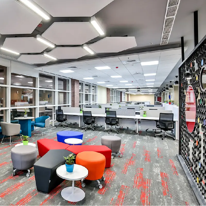 Modern grey carpet with red abstract patterns in a large open office.