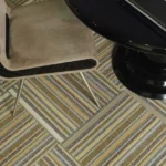 carpet tiles installed in alternating directions with chair