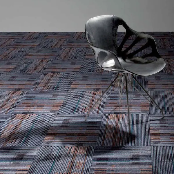 carpet tiles with navy, rust, and gray installed in modern office